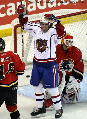 Zack Stortini as a Hamilton Bulldog, arms raised after scoring a goal